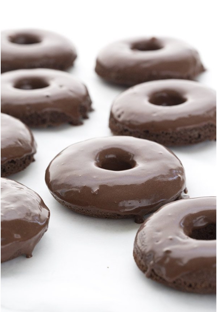 chocolate donuts, covered in chocolate, on white table, keto diet recipes