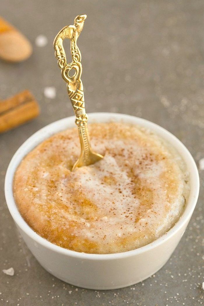 low carb breakfast, cinnamon doughnut, in a white ceramic bowl, golden small spoon