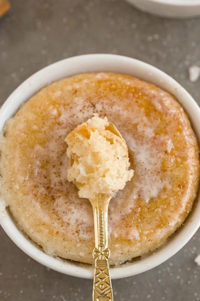 cinnamon doughnut, in a white ceramic bowl, low carb breakfast, golden small spoon