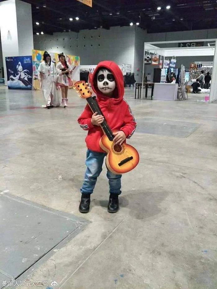 little boy, dressed as miguel rivera, holding a guitar, toddler boy costume, coco movie inspired, red hoodie