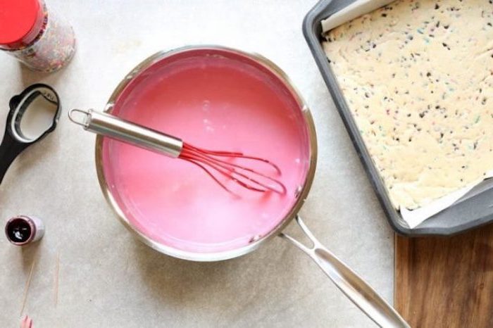 cookie dough, spread in a tray, pink melted chocolate, easy desserts with few ingredients, sprinkles in a jar