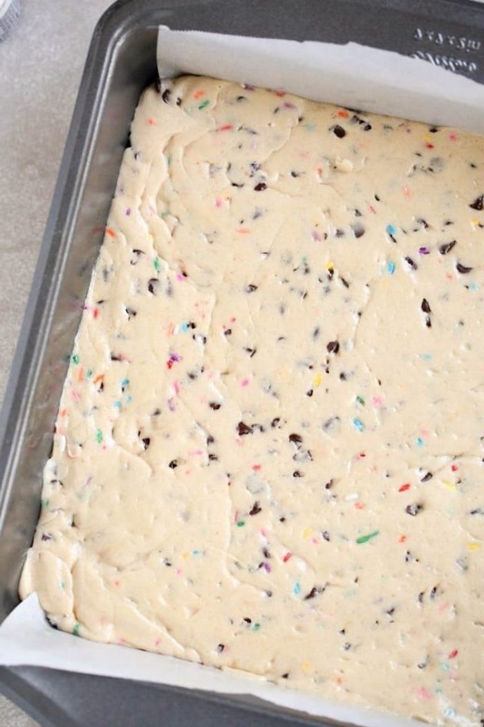 cookie dough, with sprinkles, easy desserts with few ingredients, chocolate chips, spread in a tray