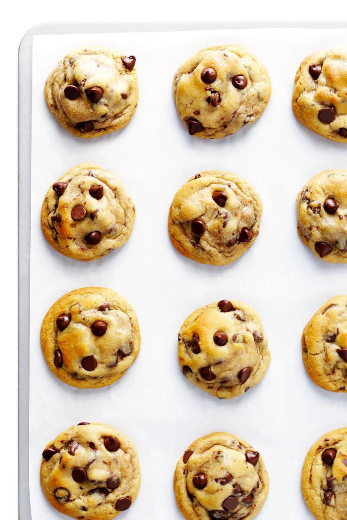cookie dough, with chocolate chips, arranged on a white board, best chocolate chip cookies