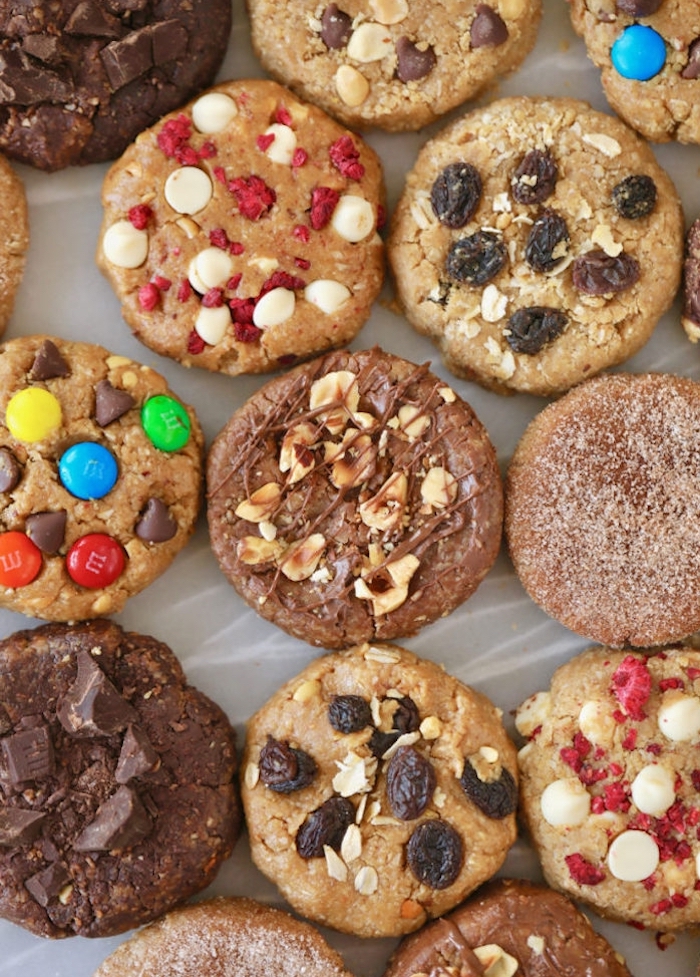 different cookies, with raisins and nuts, candy and sprinkles, soft chocolate chip cookie recipe, arranged together