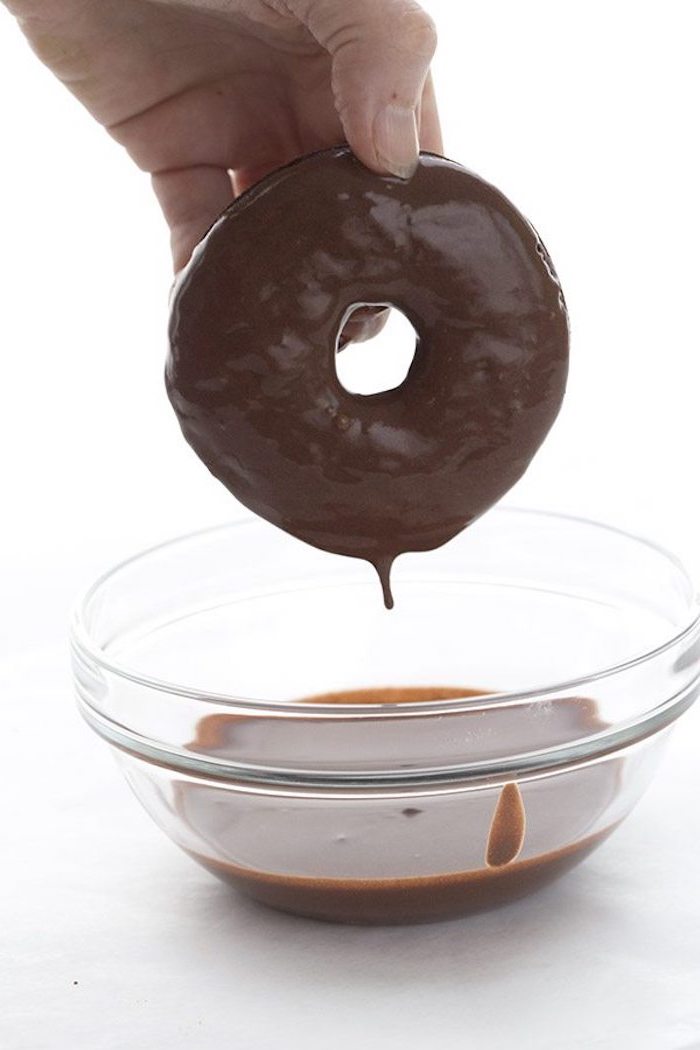 keto breakfast ideas, chocolate donut, dipped in chocolate, in a glass bowl, on white table