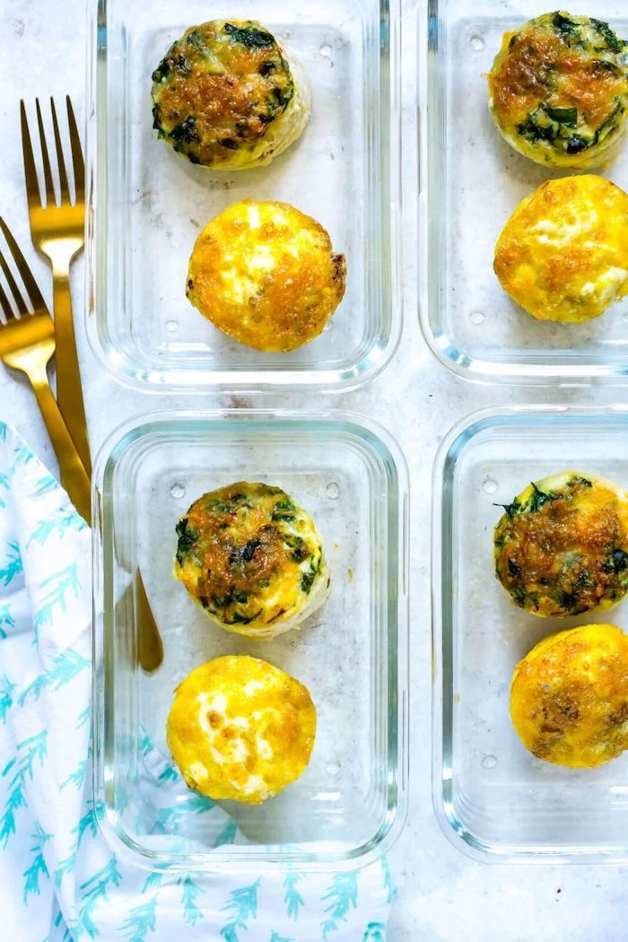 egg bites, in glass containers, meal prep ideas, brass forks, marble countertop