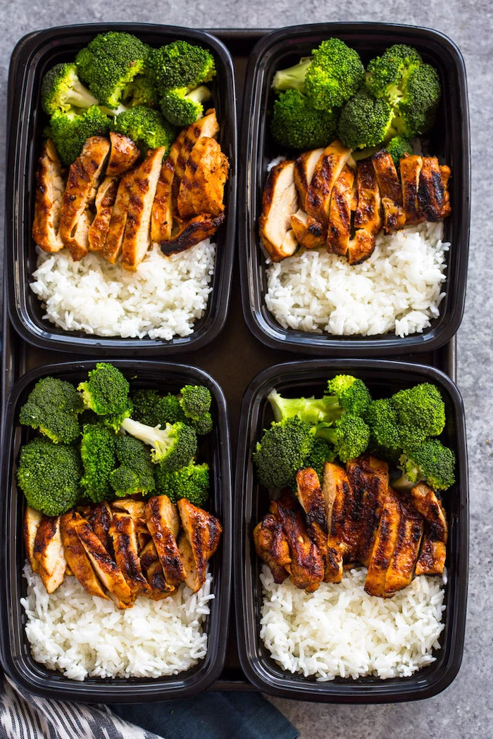 chicken fillet, broccoli and rice, healthy lunches for work, inside four black, plastic containers