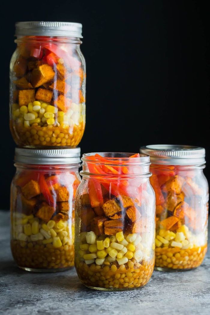four mason jars, how to meal prep, sweet potato salad, with corn and lentils, black background