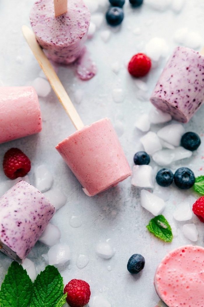 fruit lollipops, made with blueberries, raspberries yoghurt, easy summer desserts, wooden popsicle sticks