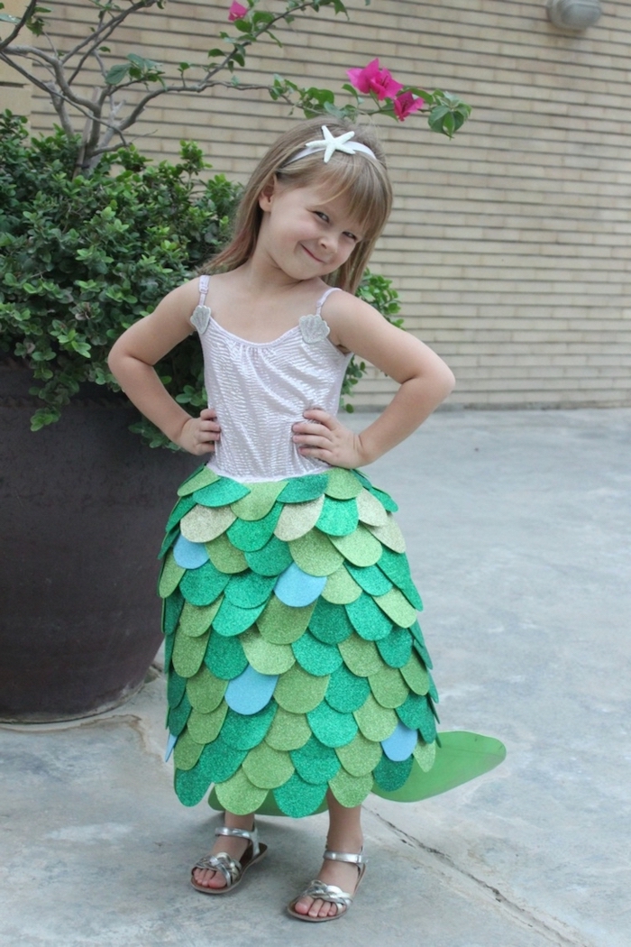 baby girl halloween costumes, little girl, dressed as a mermaid, with blonde hair, mermaid skirt, silver sandals