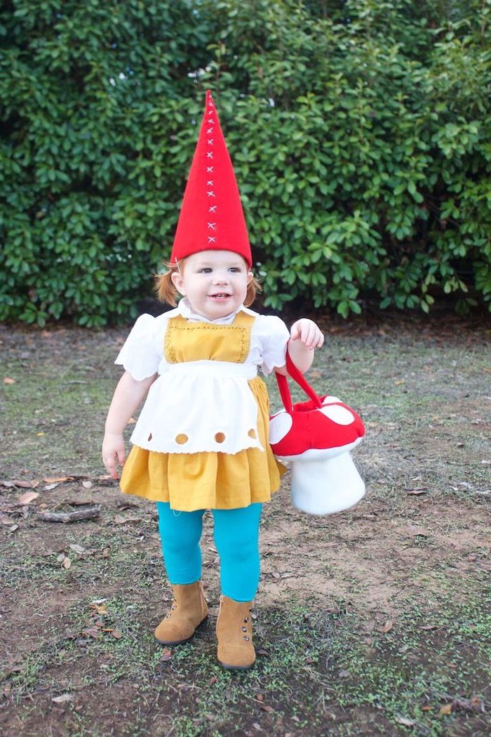 little girl, dressed as a garden gnome, large red cone hat, baby girl halloween costumes, blue tights, mushroom bag