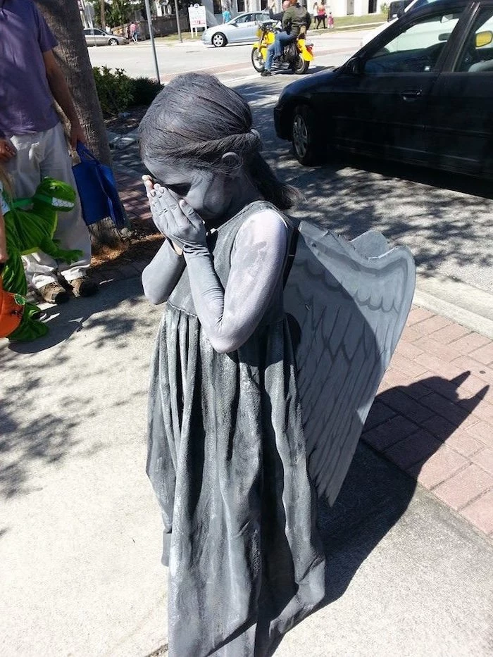 little girl, dressed as weeping angel, covered in silver paint, baby girl halloween costumes, carton wings