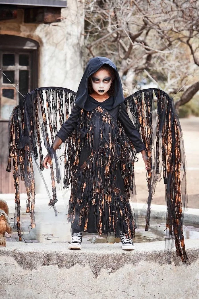 halloween costumes for kids, little girl, dressed as an angel of death, wearing black shoes, face makeup