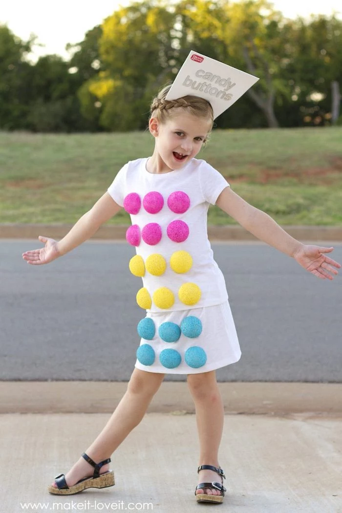 girl dressed as candy buttons, best halloween costumes, step by step, diy tutorial, white shirt and skirt