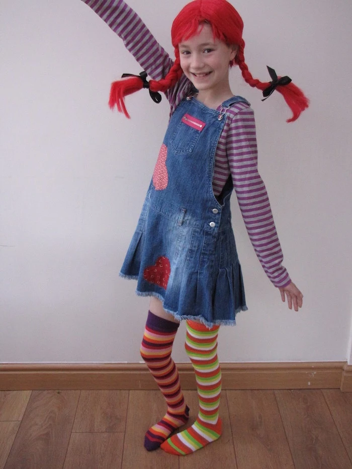girl dressed as pippi longstocking, red wig, braided in two braids, different socks, baby girl halloween costumes