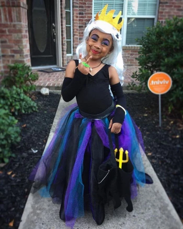 girl dressed as ursula, ariel inspired, cute halloween costumes for girls, black purple and blue, tulle skirt