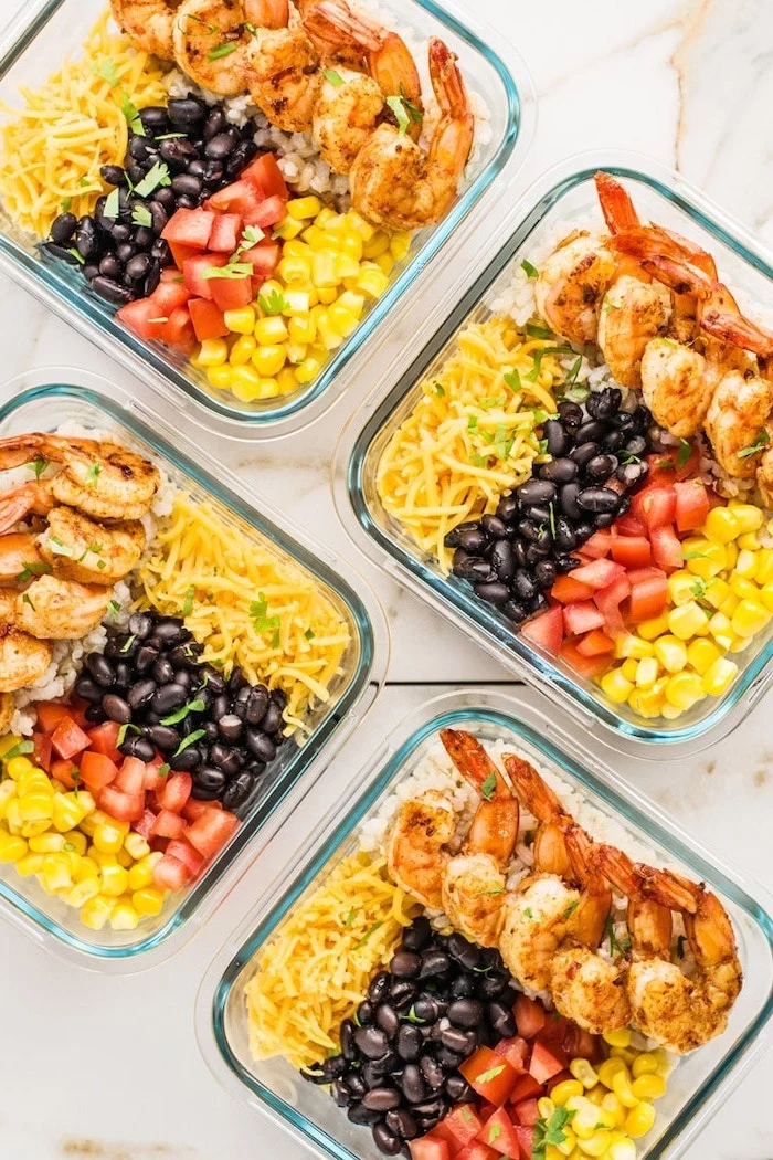 glass containers, filled with corn and cheese, shrimp and tomatoes, black beans, healthy meal prep ideas for weight loss