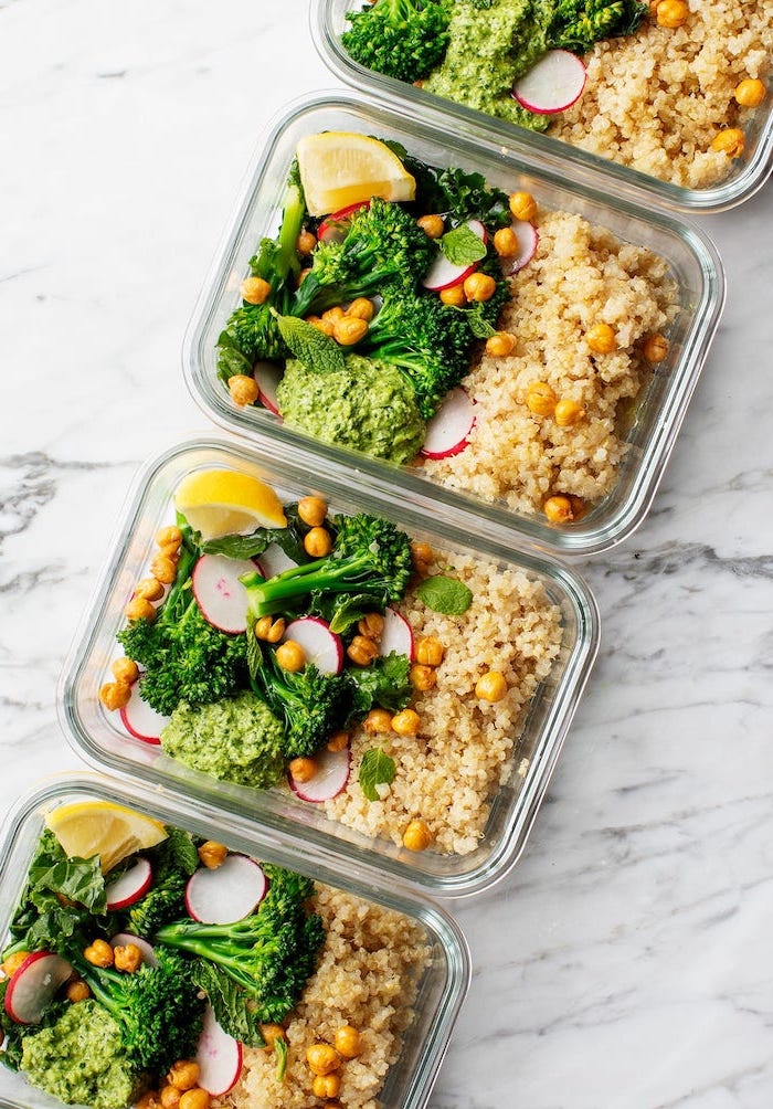 glass containers, filled with chickpeas, rice and broccoli, guacamole and turnip, meal prep for the week, marble countertop