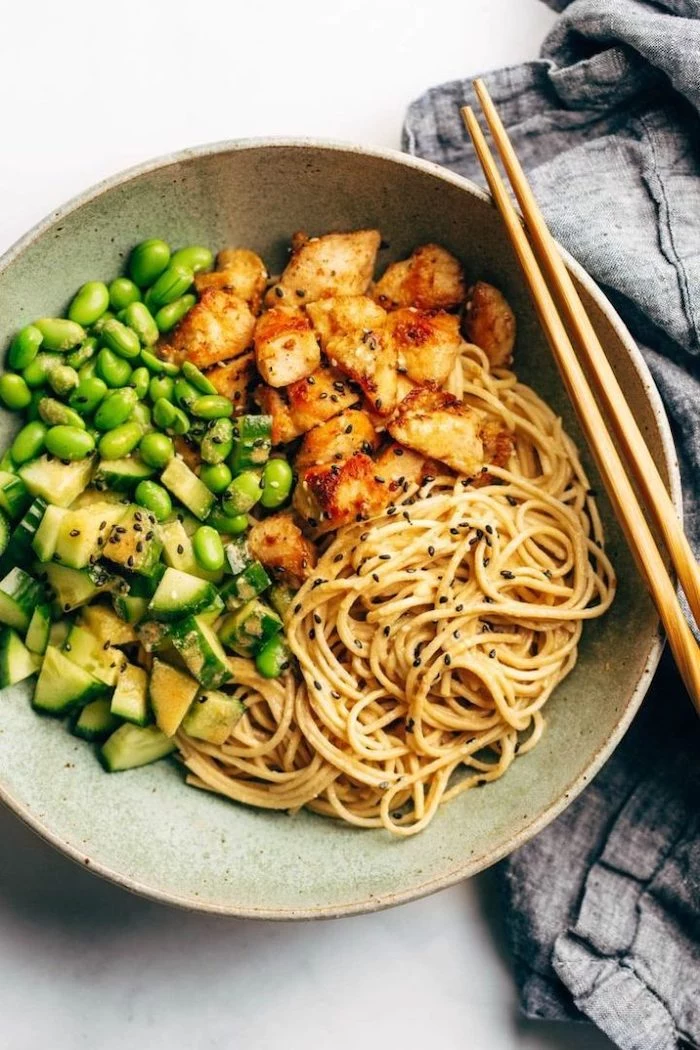 sesame noodles, beans and cucumbers, healthy meal prep ideas, chicken fillet, in a plate, chop sticks