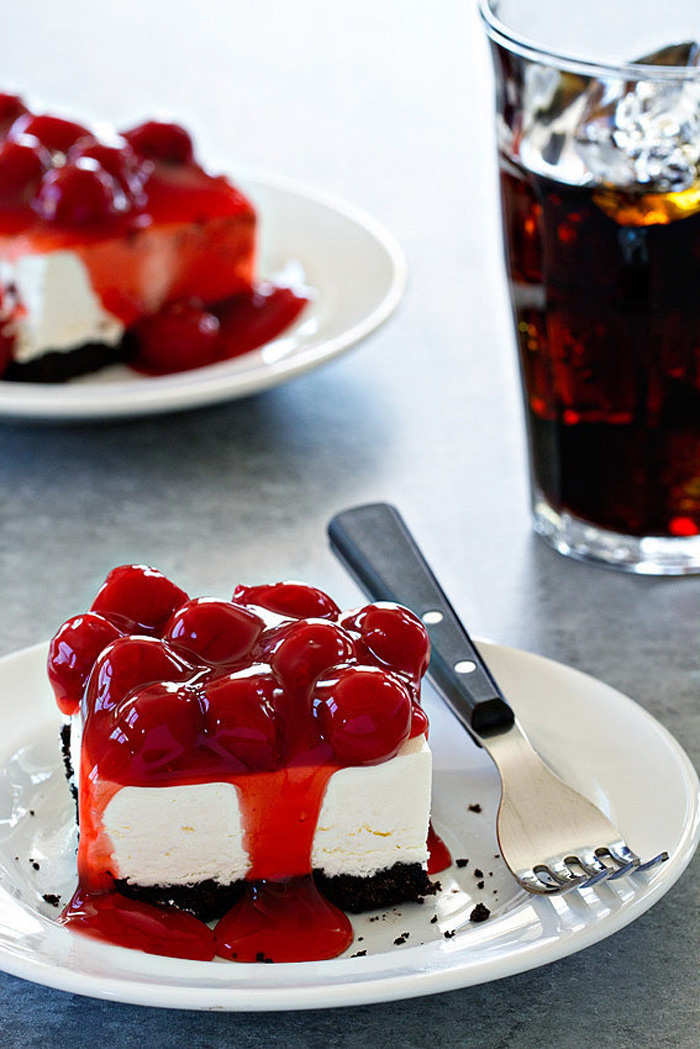 ice cream pie, cherries on top, on a white plate, no bake desserts, glass of coke, black fork