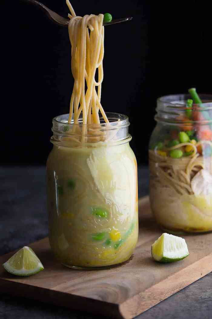 instant noodles, inside a mason jar, chicken meal prep, beans and corn, wooden cutting board, lime slices