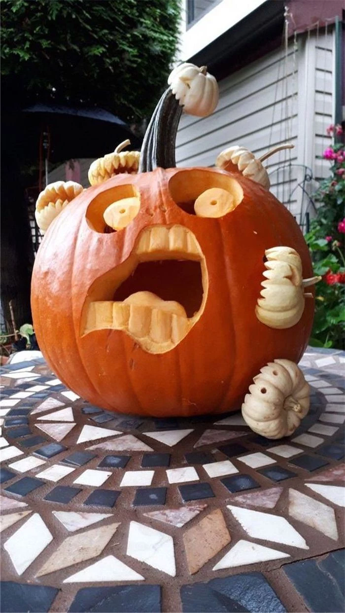 large carved pumpkin, attacked by small carved pumpkins, pumpkin carving faces, tiled floor, pumpkin inside pumpkin carving patterns