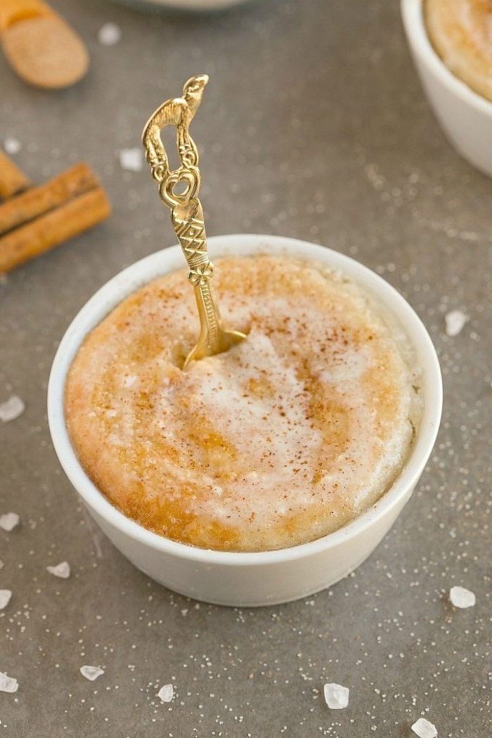 golden small spoon, low carb breakfast, cinnamon doughnut, in a white ceramic cup