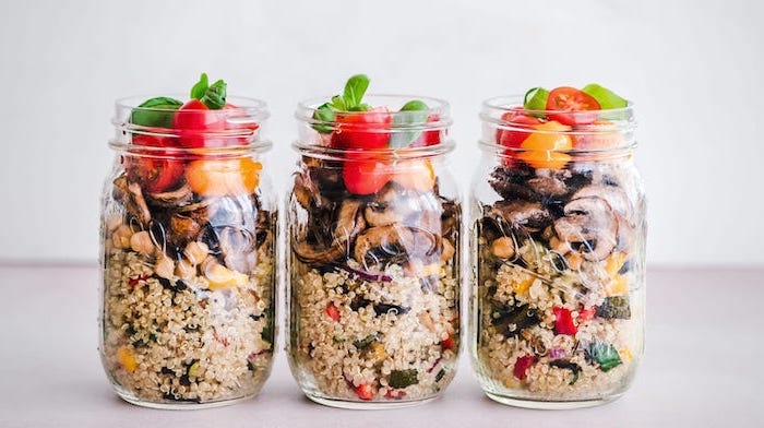 three mason jars, easy lunches for work, cherry tomatoes, quinoa salad, chopped mushrooms