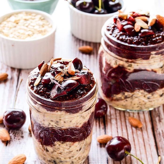 cherry jam, granola and yoghurt, inside a mason jar, easy lunches for work, wooden table, cherries around