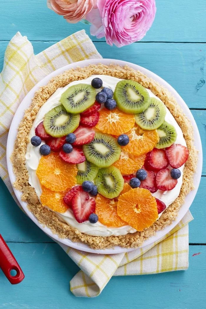 fruity tart, slices of different fruits on top, kiwi and orange, strawberries and raspberries, easy dessert recipes