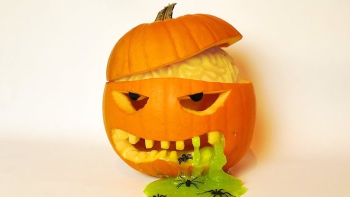 pumpkin vomiting green slime, spiders inside, unique pumpkin carving ideas, brains coming out