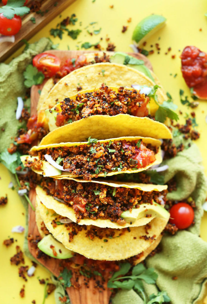 green table cloth, taco ingredients, tortilla wraps, filed with quinoa, salsa sauce, cherry tomatoes