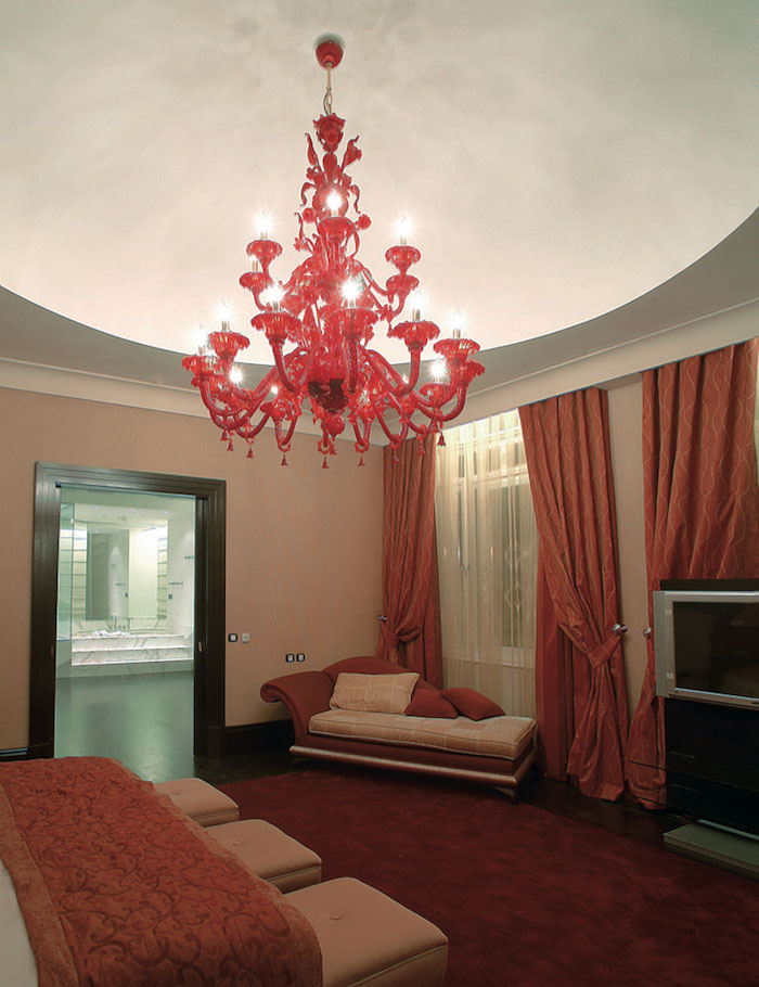 red and beige interior, murano glass chandelier, red chandelier, red carpet, red curtians
