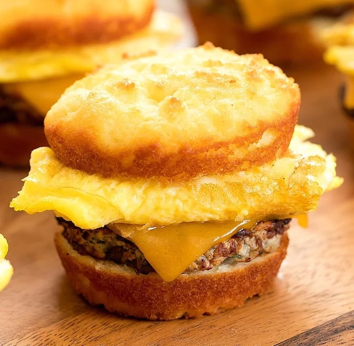 low carb breakfast without eggs, egg sandwich, with cheese and ground beef, wooden table