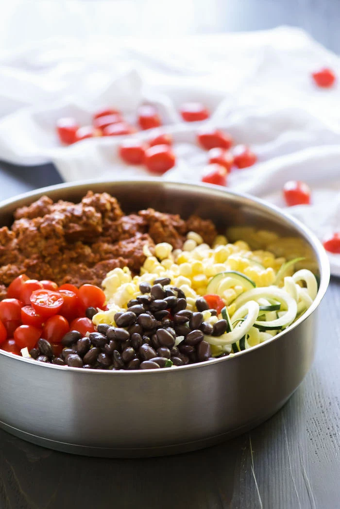 ground turkey, cherry tomatoes, black beans, corn and zoodles, in a skillet, how to make zucchini noodles