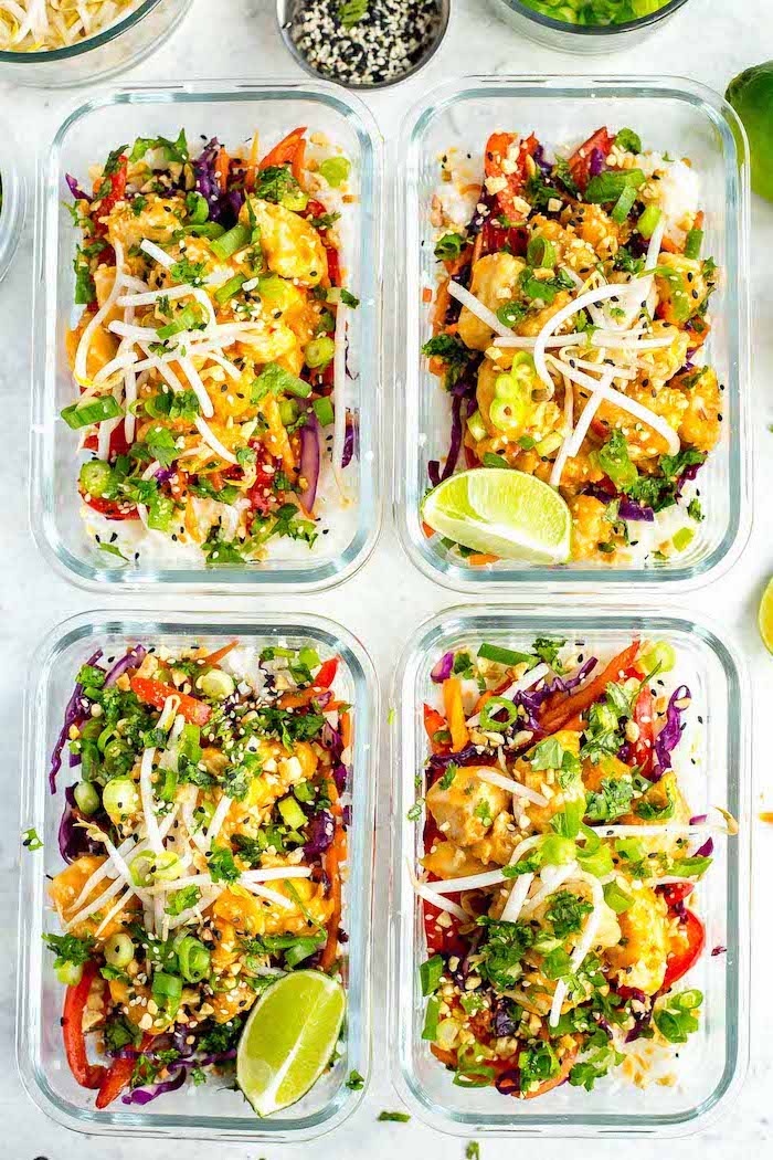 thai chicken, inside glass containers, meal prep recipes chicken, lemon slices on the side, sesame seeds