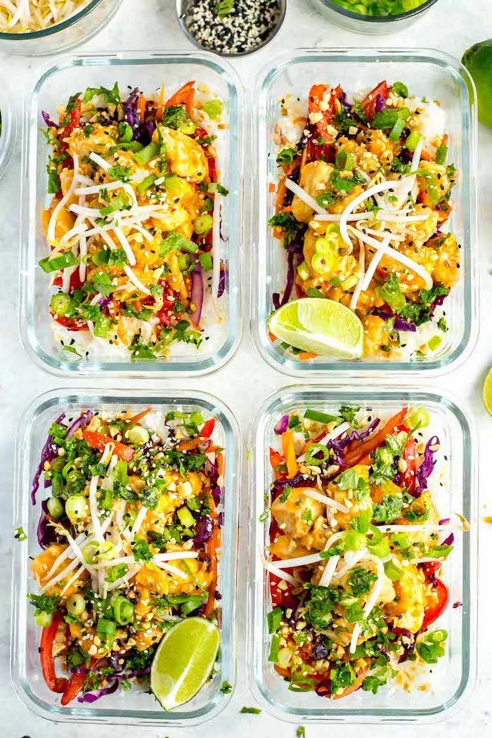 thai chicken, inside glass containers, meal prep recipes chicken, lemon slices on the side, sesame seeds