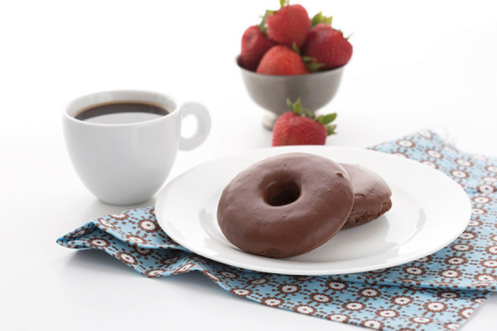 chocolate donuts, on white plate, keto breakfast ideas, coffee mug, strawberries in a metal bowl