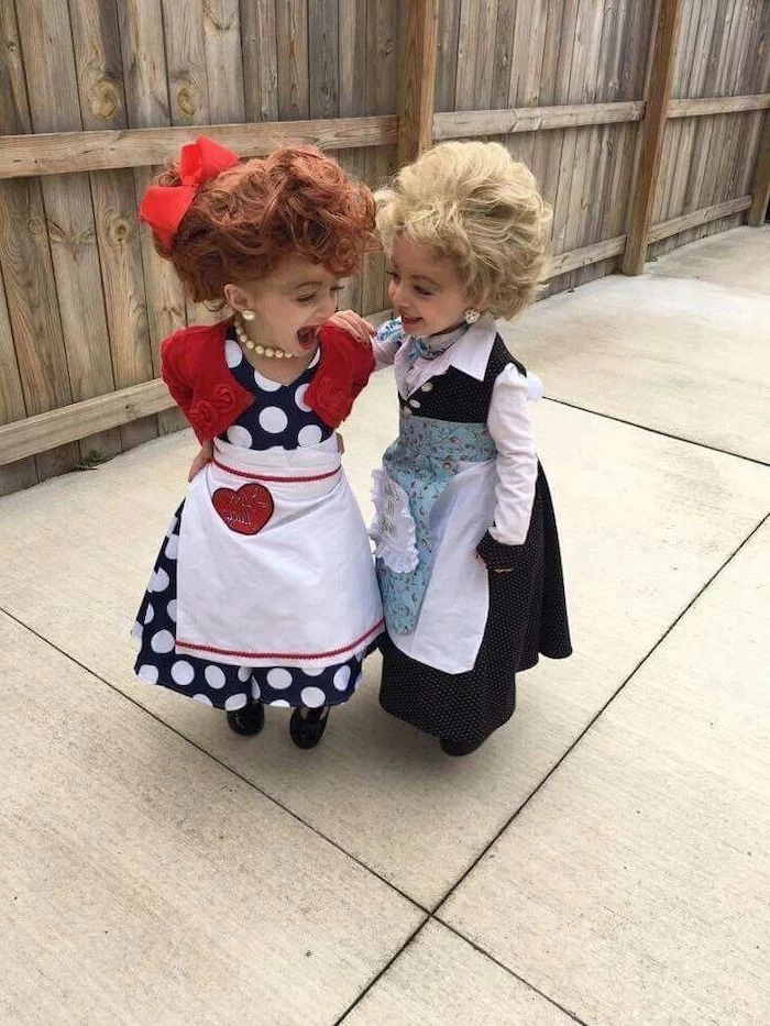 two girls, dressed as characters from i love lucy, funny halloween costumes for kids, pearl necklace, alrge wigs