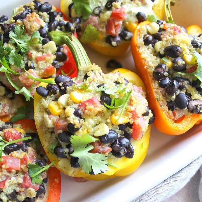 bell peppers, sliced in half, filled with quinoa, black beans, corn and tomatoes, meal prep recipes weight loss
