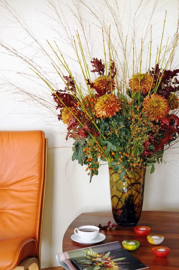autumn flowers, large bouquet, thanksgiving decorations, wooden table, orange leather armchair