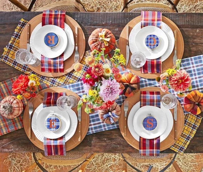 plate settings, on wooden table, flower bouquets, flannel table cloths, thanksgiving decorations