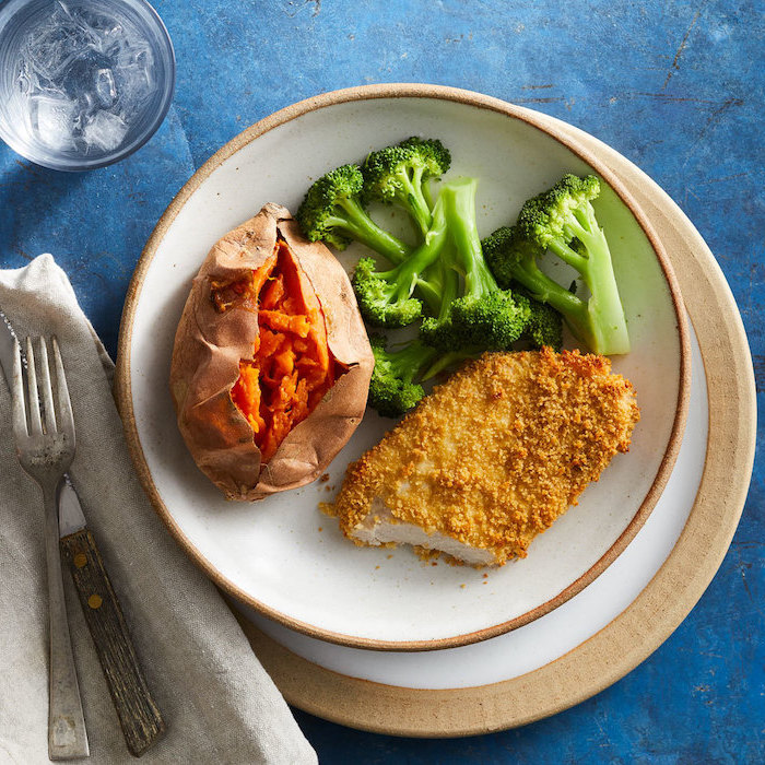 chicken breast, covered in breadcrumbs, baked sweet potato, broccoli in a plate, healthy meal plans
