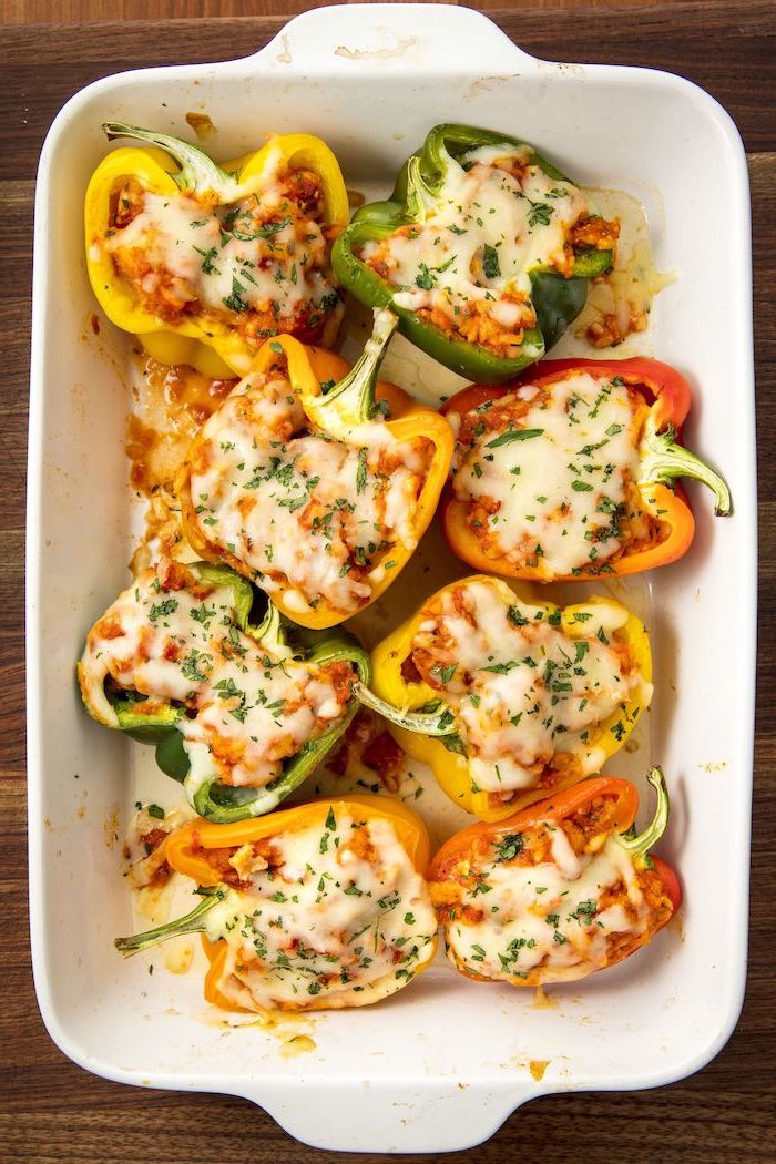 stuffed bell peppers, chicken parmesan, healthy meal plans, white casserole, wooden table