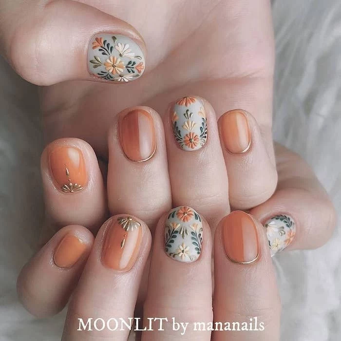 orange and grey nail polish, fall nail designs, floral designs, short squoval nails, white background
