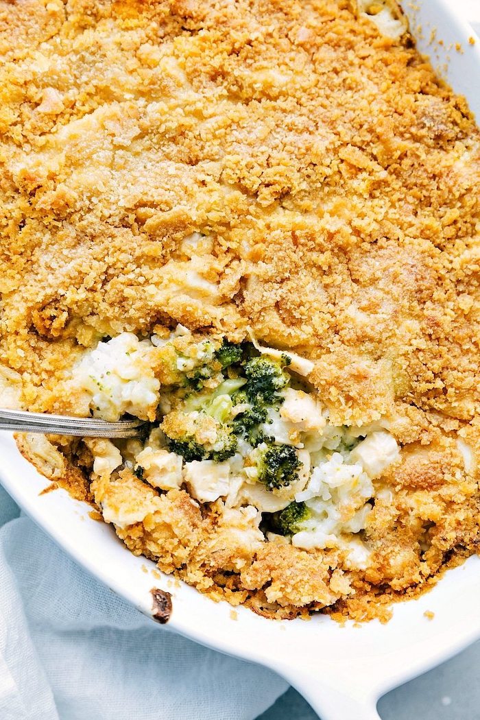 rice with broccoli and cheese, breadcrumbs on top, in white casserole, spoon inside, weeknight dinners