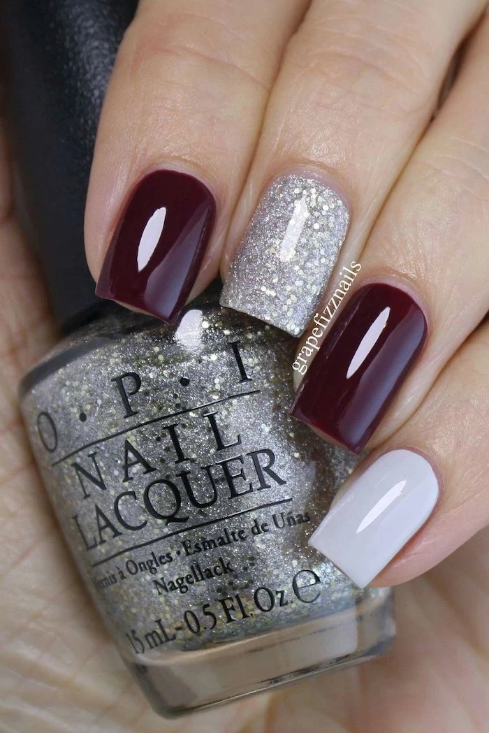 burgundy red, silver glitter, nail polish, hand holding, nail polish bottle, popular nail colors, short square nails