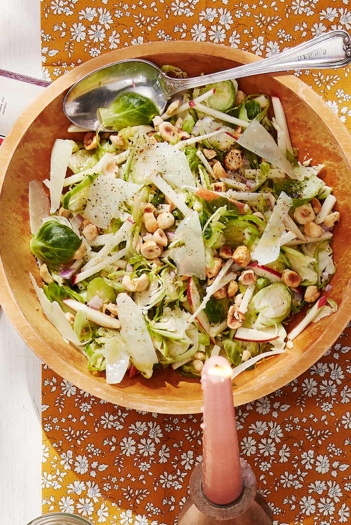 orange floral cloth, easy dinner recipes for two, brussels sprouts salad, with parmesan and nuts, in wooden bowl