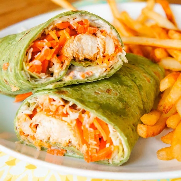 buffalo chicken wraps, french fries on the side, sour cream in side, easy dinner recipes for two, white plate