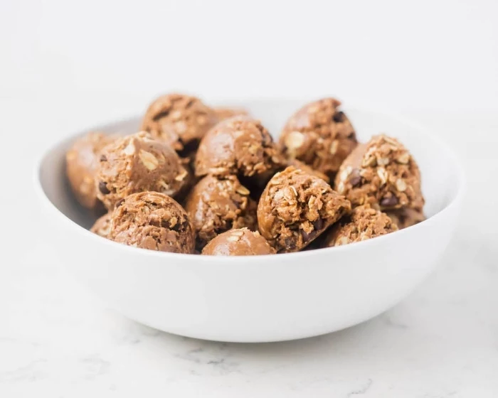 oatmeal bites, no bake energy bites, with peanut butter, chocolate chips, in white bowl